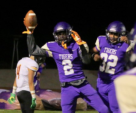Lemoore's Chris Taylor celebrates after his first half touchdown reception. Lemoore took a 14-7 lead into the half, but eventually lost to Tulare Union 27-14.